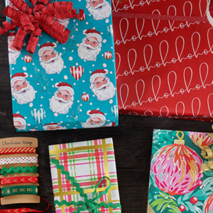 Colorful Christmas wrapping paper and gift wrap arranged neatly, ready for holiday gift-giving and festive celebrations.