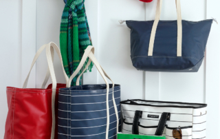 A collection of bags in various colors and patterns displayed together.