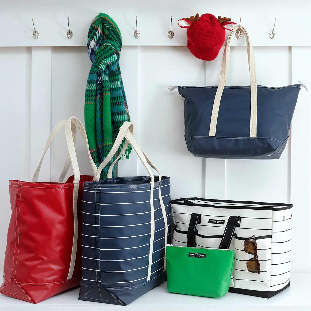 A collection of bags in various colors and patterns displayed together.